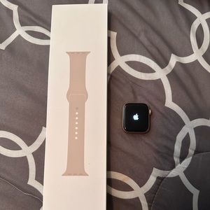 Used but like new. Includes rose gold watch, new band, and a charger.